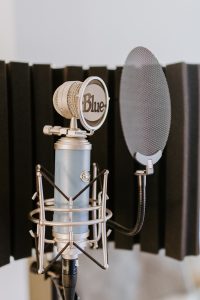 silver and black microphone on black and silver microphone stand